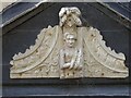 Carved figure on a lintel