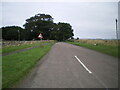 Looking SE along Swinhoe Road towards a sharpish left-hander