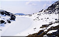 NG9551 : Frozen and snowed-over lochan by Trevor Littlewood