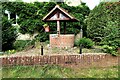 Well cover in garden of Northcroft, New Cut, Westfield