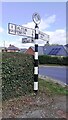 Cumberland County Council finger signpost at T-junction in Cumwhinton