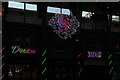 View of "Dream", dragon and "Bazaar" neon lights in Covent Garden