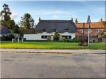 SP7311 : Thatched cottages on Aylesbury Road, Cuddington by David Howard