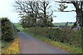 NS4548 : Country road at Mid Hairshaw by Alan Reid