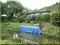 Canal boat under cover on Monmouthshire and Brecon Canal