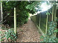 Public footpath with signpost and waymark