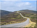 NJ2510 : The A939 looking towards the Lecht pass by Bill Harrison