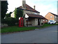 Telephone box and bus shelter on Rectory Lane, Hotham