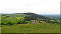 On the summit of  Moel Hiraddug with view towards Mynydd y Cwm