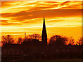 SD7708 : Sunset behind St Andrew's Church by David Dixon