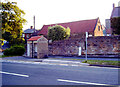 Bus shelter and milestone, High Street (A174), Hinderwell