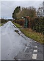 Dark green bus shelter, Whitson