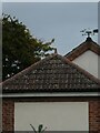 Windvane in shape of saw, shed and text, Bridgwater