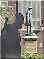 A WWI memorial and statue of Daniel Owen