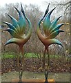 SY7891 : Sculpture by the lakes - Two colourful birds by Rob Farrow