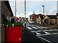 SE1922 : Crocheted figures on post box, Roberttown Lane, Roberttown, Liversedge by habiloid