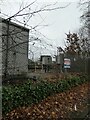 Platform at Woking Station glimpsed from Maybury Road