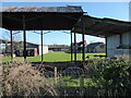 Empty old hay barns on a farm