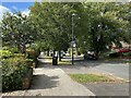 Downhill, northwest and a bus stop on Telford Avenue, Lillington