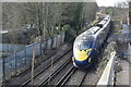 Eastbound Javelin train approaching footbridge at Denton