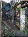 Graffiti on pipe supports near Lock 6E, Huddersfield Narrow Canal, Paddock