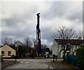 Piling rig drilling holes for steel reinforcements in the foundations of the  flood  wall  at  the Shimna Mile