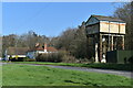 Water tower and houses on the A360 near Druid