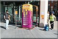 View of a "Saucy Hotline" telephone box in Bishops Square