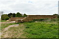 Dalham: Large hardstanding area surrounded on three sides by baled hay