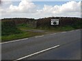 Gate off the A487 and sign for camping