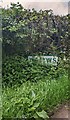 Partly obscured Bettws boundary sign, Monmouthshire