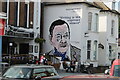 View of a Somerset Maugham mural on the side of Perry Law Solicitors on Oxford Street