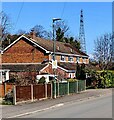 Fences, houses and a distant pylon, Frampton on Severn