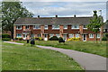 Houses overlooking green at Woodley