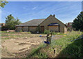 Chesterton: through a site gate on Fen Road