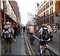 SJ8497 : Riders on Oxford Street by Gerald England