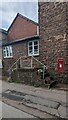 Queen Elizabeth II postbox in a stone wall, Llangarron