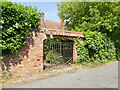 Locked decorative entrance to The Hollyhocks