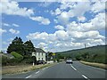 Car passing a cyclist on the A487, heading east