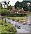 Signpost on a grass triangle, Lower Grove, Herefordshire