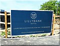 Sign at new building development north of Battle, East Sussex