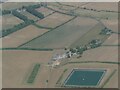 Patterned ground and circular cropmarks on field north of Moulton, Suffolk: aerial 2022