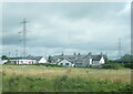 Houses on Ballyclare Road seen from a passing train