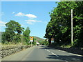 Llidiart-y-parc village sign on the A5