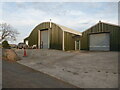 Sheds and an old car near Hanley Swan