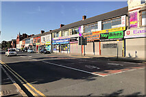 SJ3495 : Bootle, Shops on Stanley Road by David Dixon