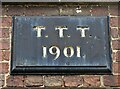 Stone plaque on the front of Home Farm