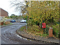 Postbox on a muddy corner