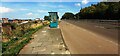 Looking NE along the A184 (Askew Road) at bus stop