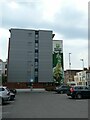 Blank end wall of hetel, with mural beyond, Cheltenham